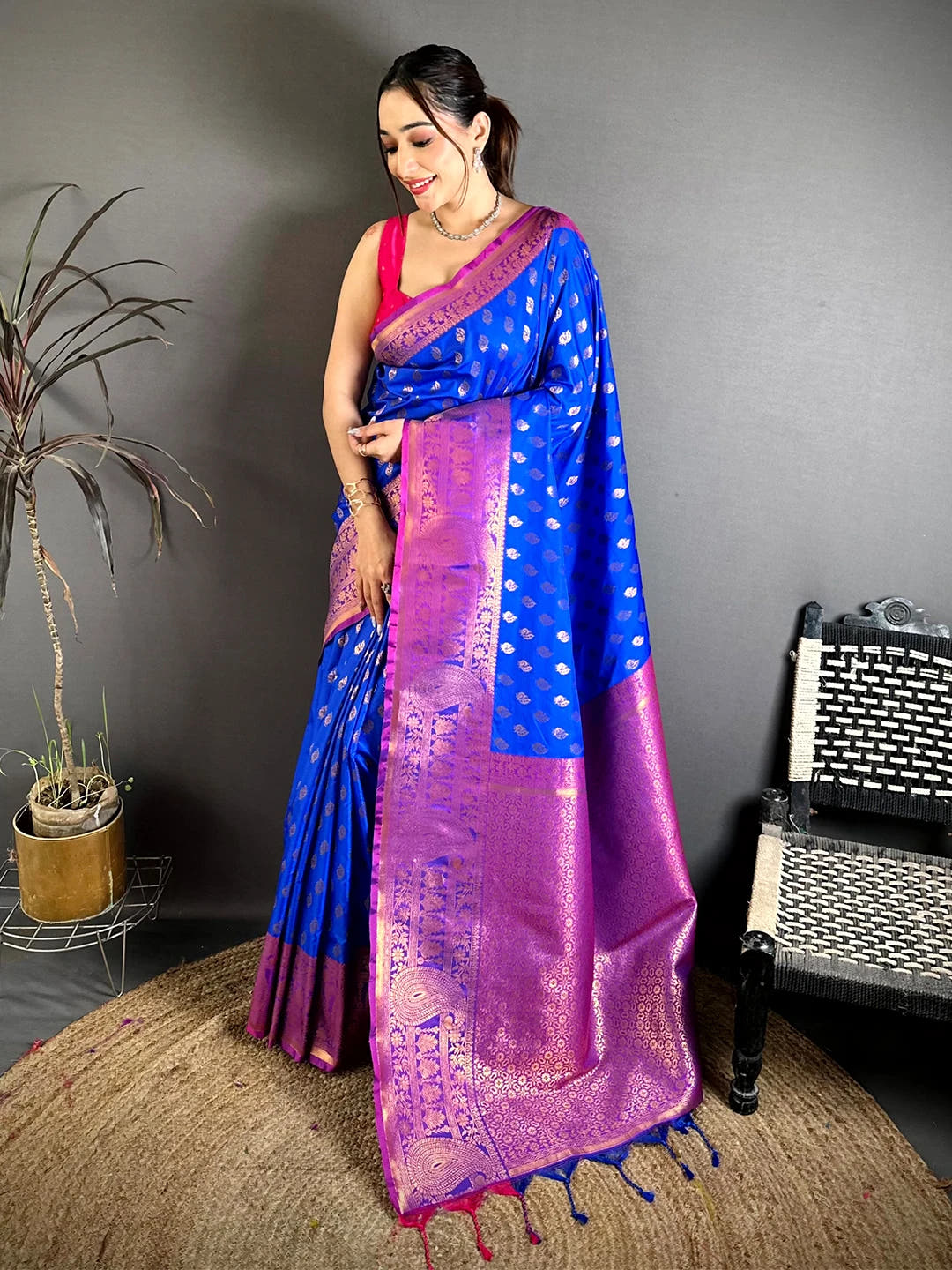 Royal blue soft silk zari woven buta saree, full length front view on model showing rich pallu and magenta tassels
