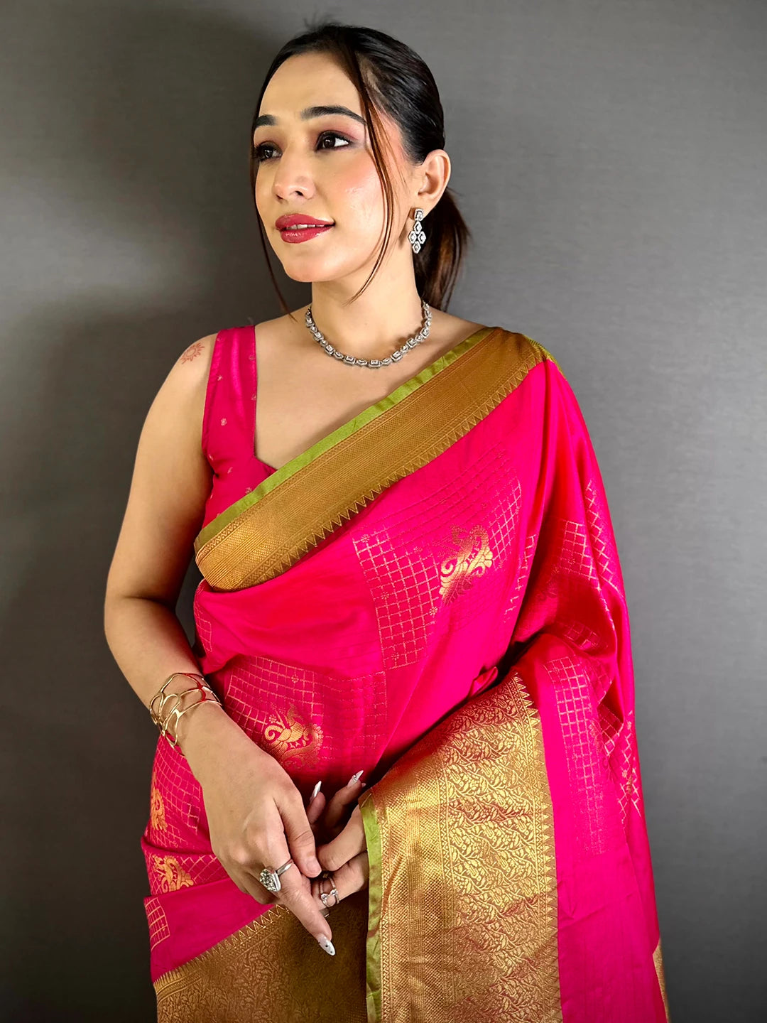 Pink Soft Silk Zari Butti saree, front drape on a model showing the checked grid and gold zari butti motifs