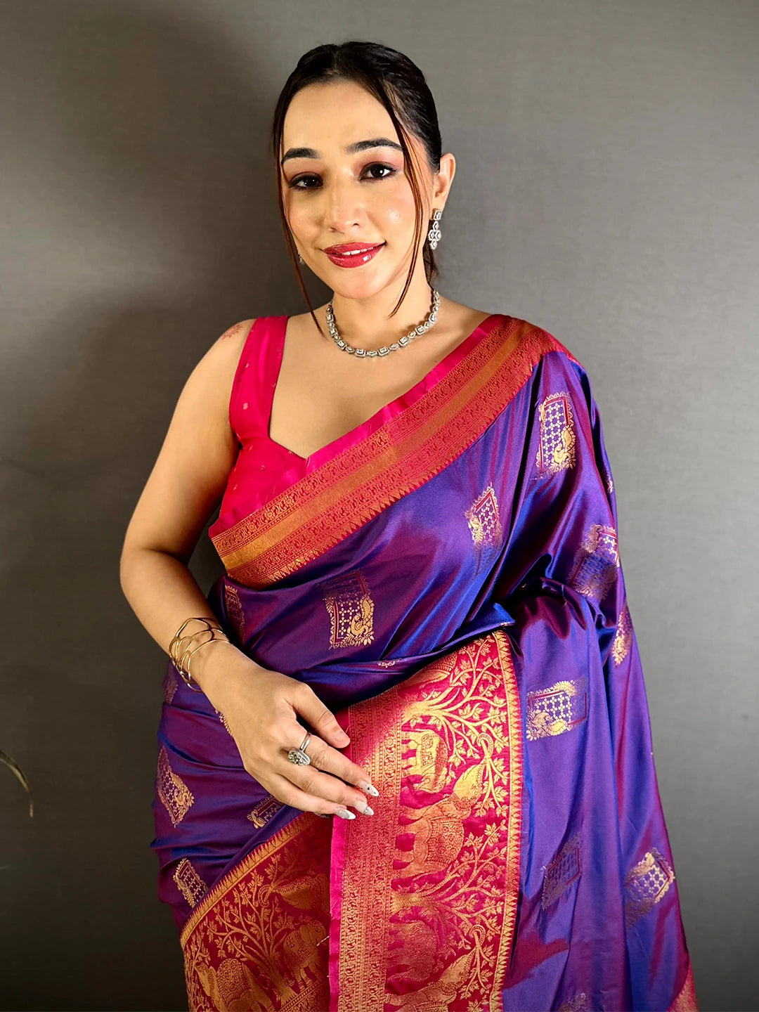 purple soft silk woven butta saree, front drape on model with pink Kanchi-style border and pink blouse piece