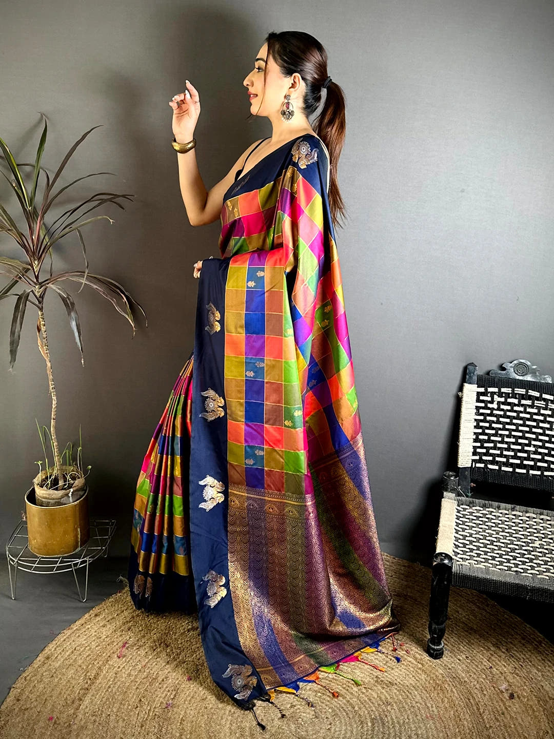 Navy multi colour soft silk checks saree, side view of the drape over a plain black blouse with the rich pallu