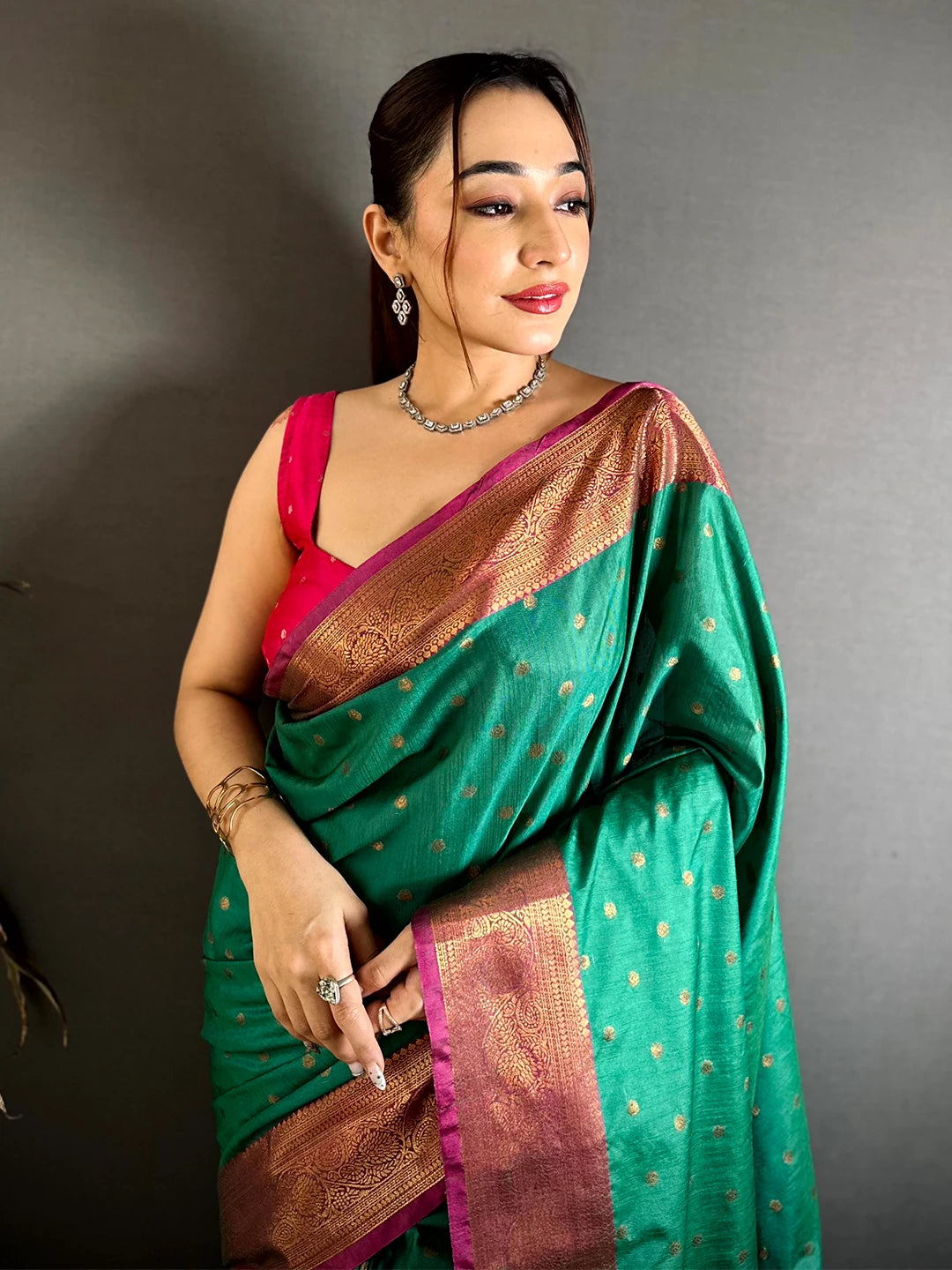Teal Green Raw Silk Zari Buti Saree, close-up of the front drape with magenta-edged zari border and pink blouse