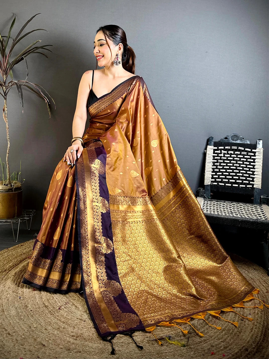Copper soft silk tree Gadwal zari saree, pallu spread with the woven pattern and tassels at the end
