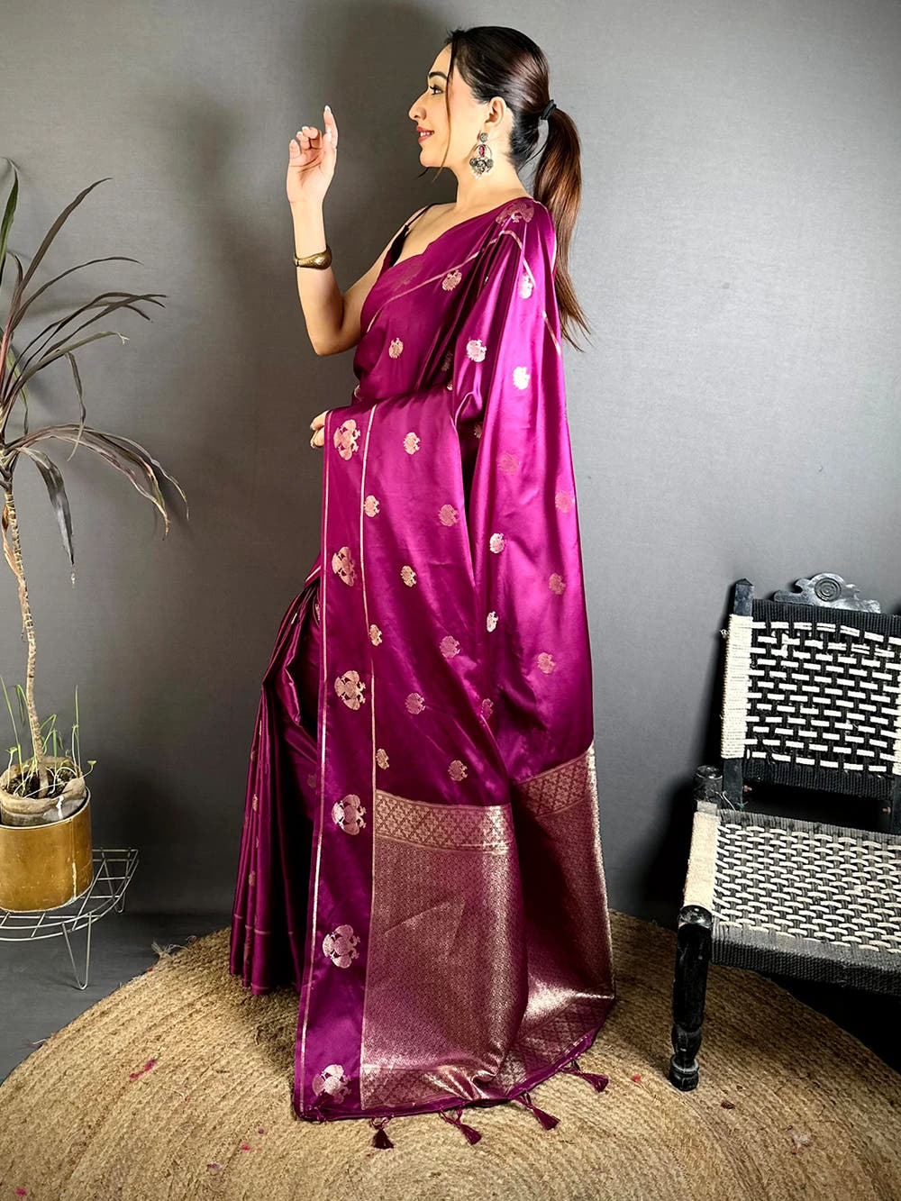 Wine mashru satin silk Garuda zari butta saree, side profile showing the drape and the broad pallu border