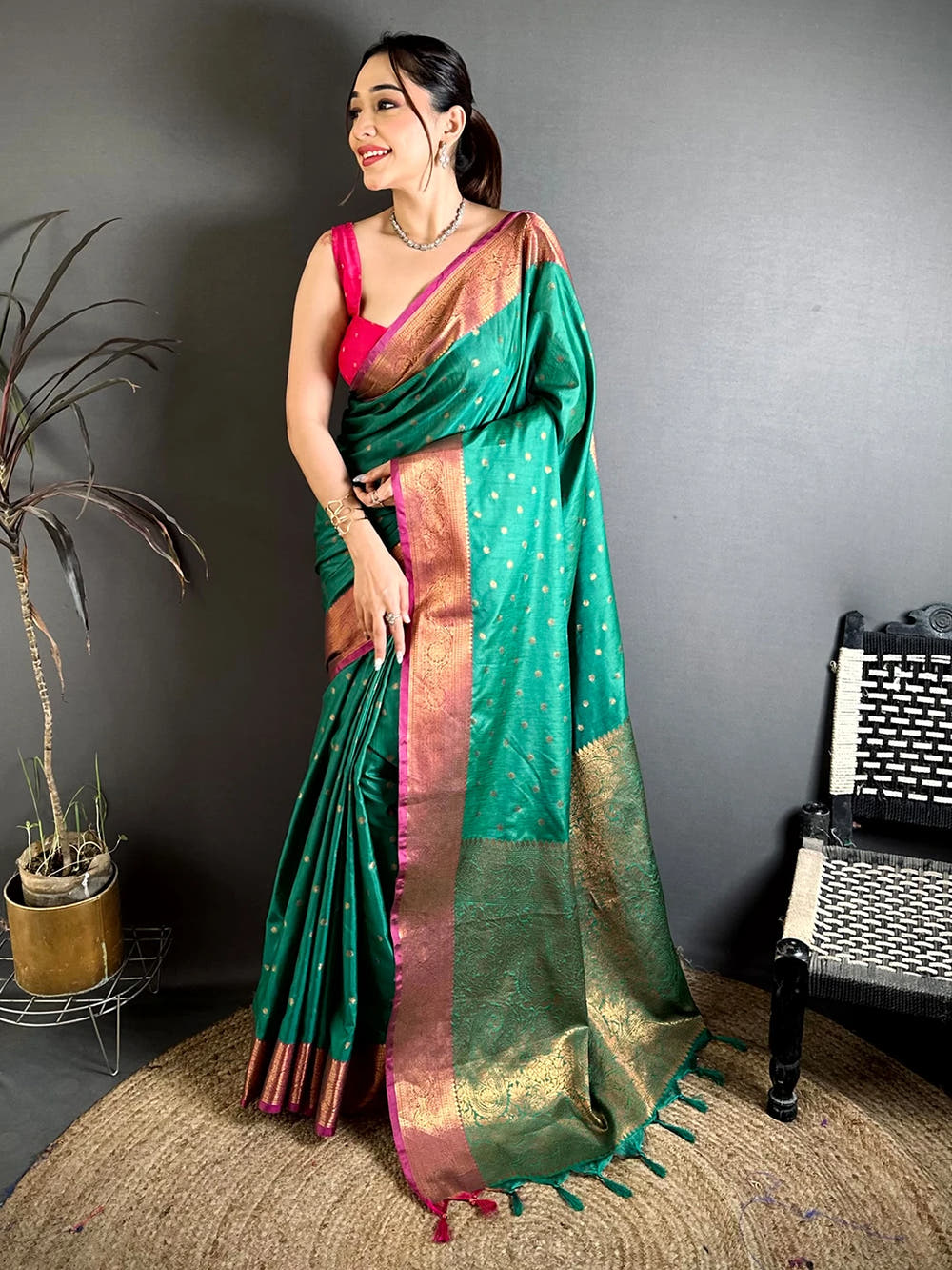 Teal Green Raw Silk Zari Buti Saree, full front view on a model showing the buti body and woven pallu with tassels
