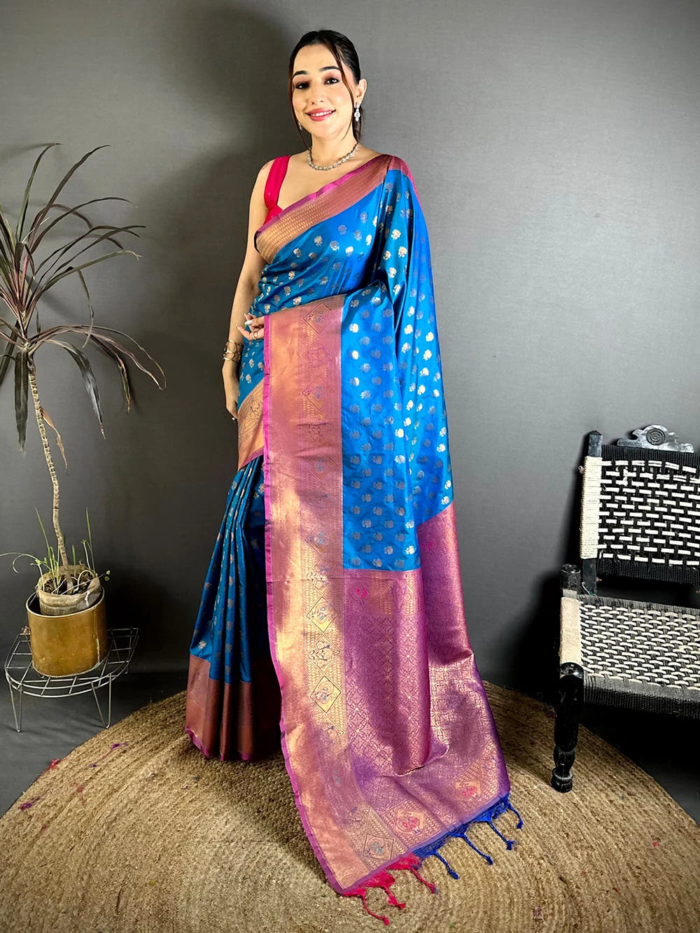 Blue soft silk lotus zari butti saree, full-length front view with contrast pallu and pink and blue tassels