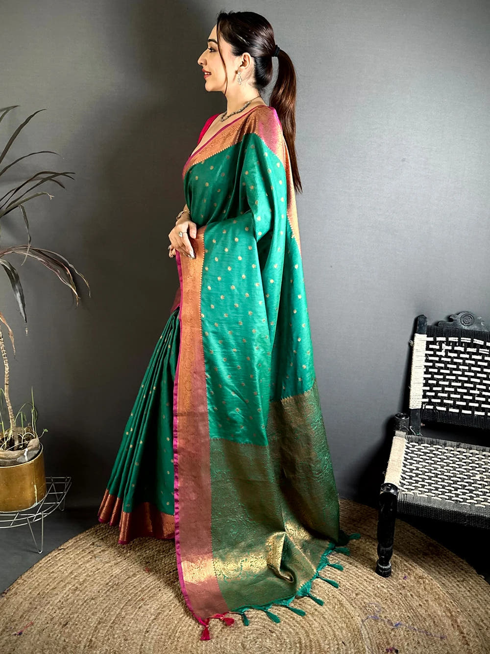 Teal Green Raw Silk Zari Buti Saree, side view of the drape showing the woven pallu and tassels at the end