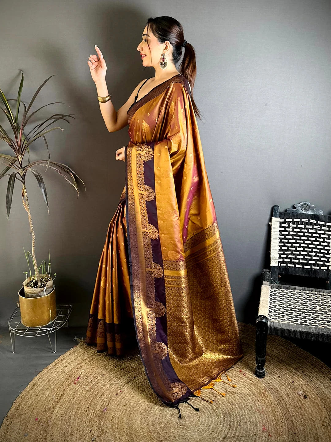Copper soft silk tree Gadwal zari saree, side profile showing the pallu drape and the broad zari border