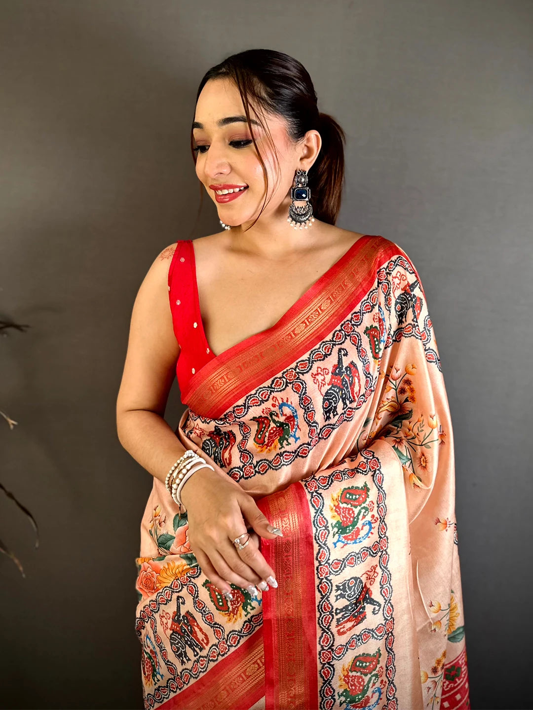 Exclusive Peach Soft Silk Ikkat Patola Print Saree