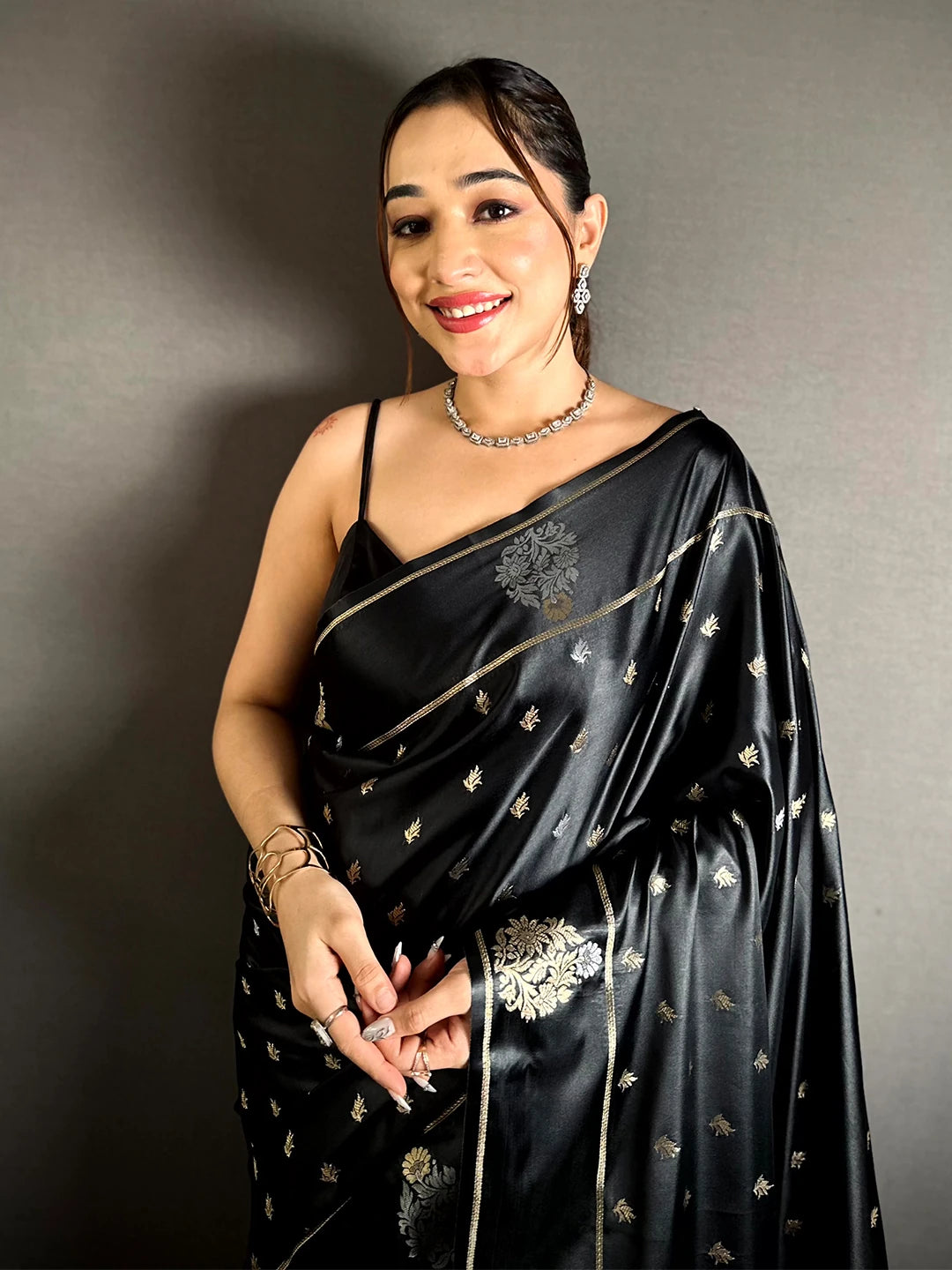 Black Mashru Silk Zari Butta Saree, front close-up of the drape on a model showing silver and gold butta over the body