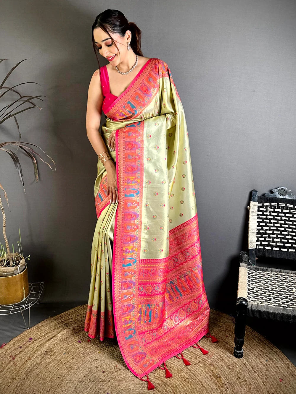 Pista green soft silk Dharmavaram-style saree, full front view on model showing pink pallu border and tassels