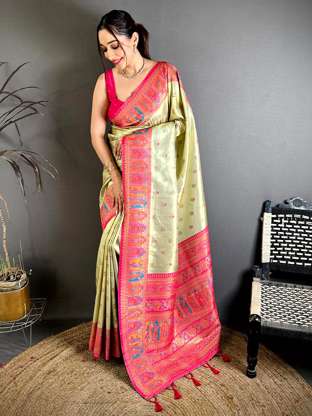 Pista green soft silk Dharmavaram-style saree, full front view on model showing pink pallu border and tassels