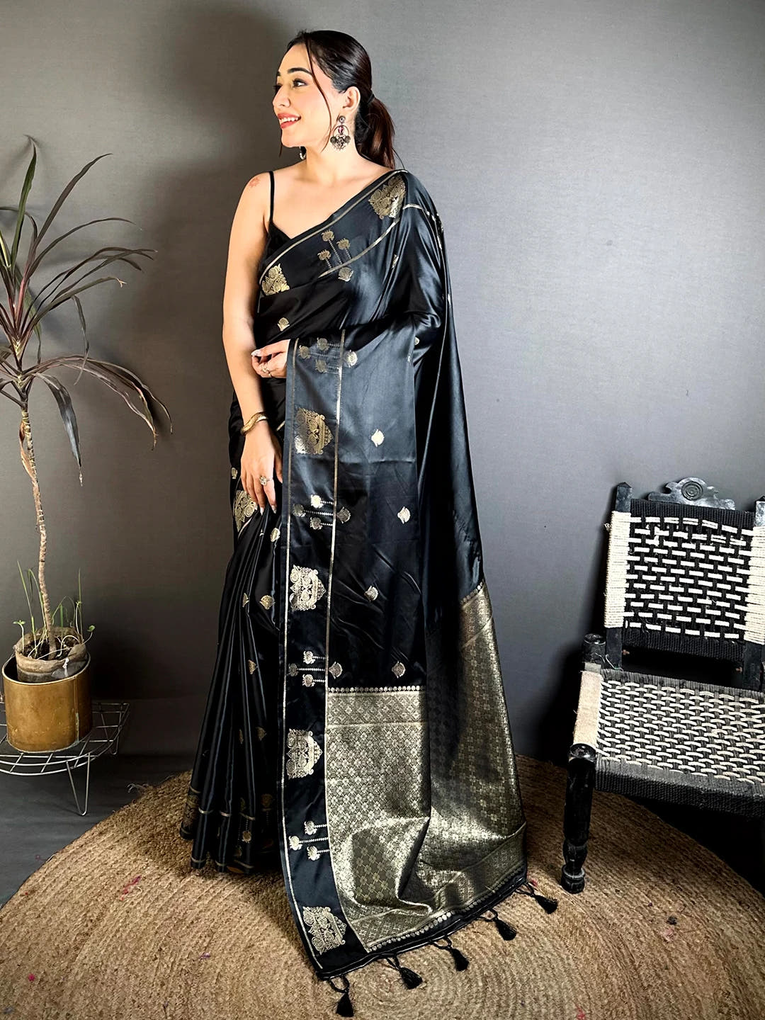 Black Mashru Satin Silk zari peacock butta saree, full length front view on model showing the woven pallu and tassels