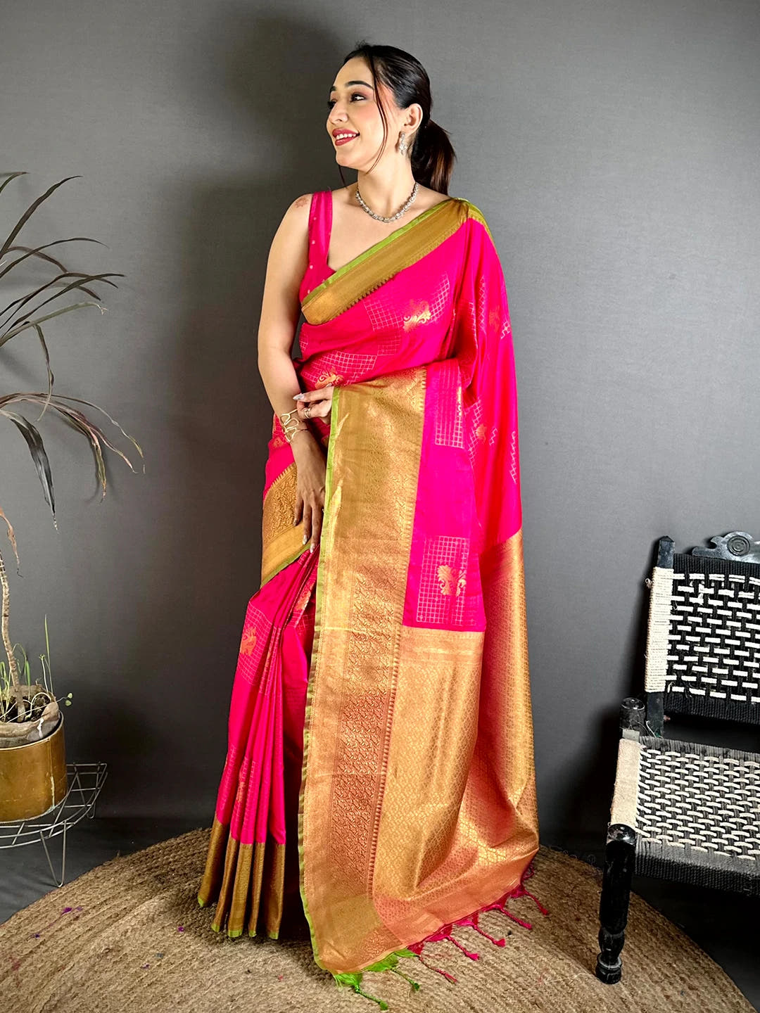Pink Soft Silk Zari Butti saree, full-length front view on a model with the broad zari border and gold pallu