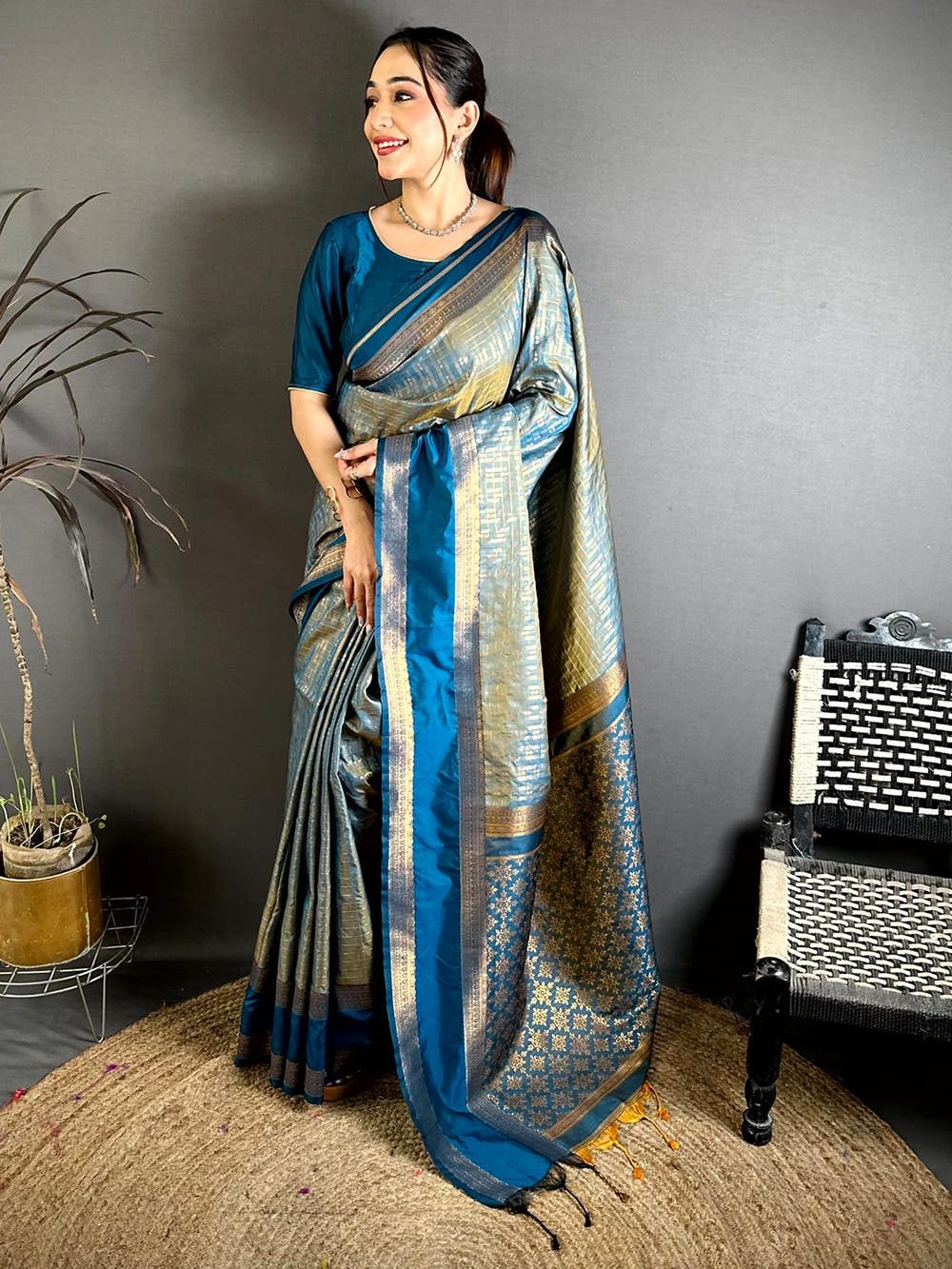 Teal Soft Silk Gold Checked Butta Saree, full front view on jute rug with the gold woven pallu