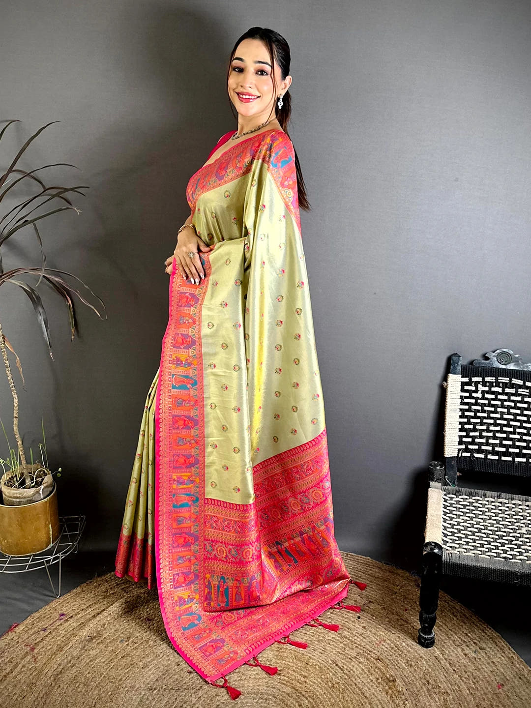 Pista green soft silk Dharmavaram-style saree, side view of the drape showing buti motifs and pink border