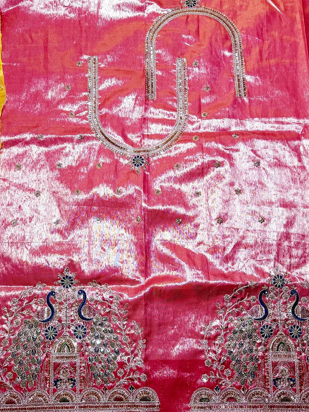 Aqua organza tissue Paithani-style minakari saree, unstitched pink blouse piece laid flat with zari neckline