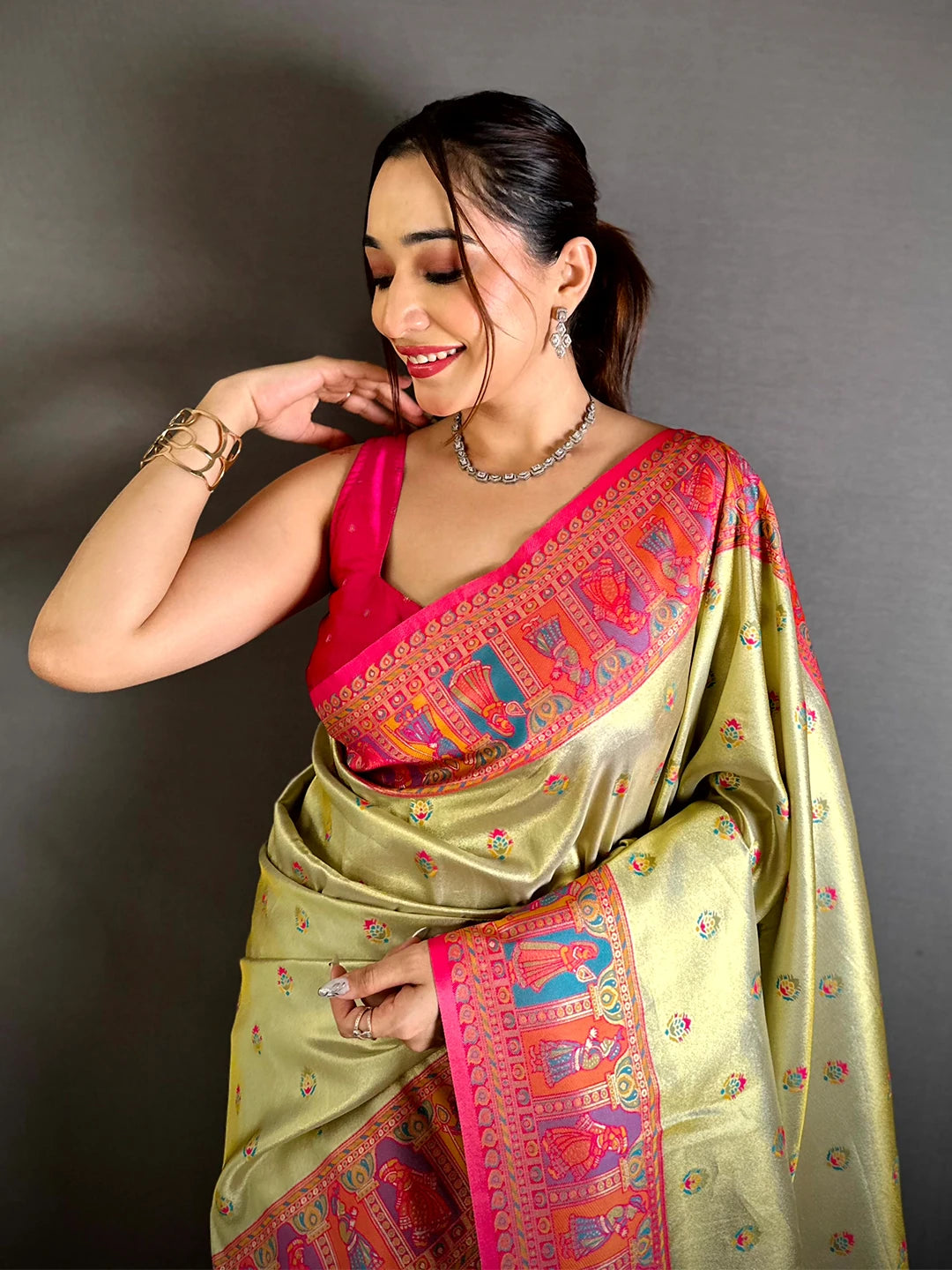 Pista green soft silk Dharmavaram-style saree, upper body front drape on model with pink blouse and woven figure border