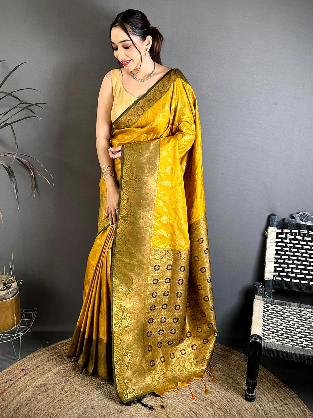 Mustard yellow soft silk woven buti saree, full front drape with broad gold woven pallu and olive-green border