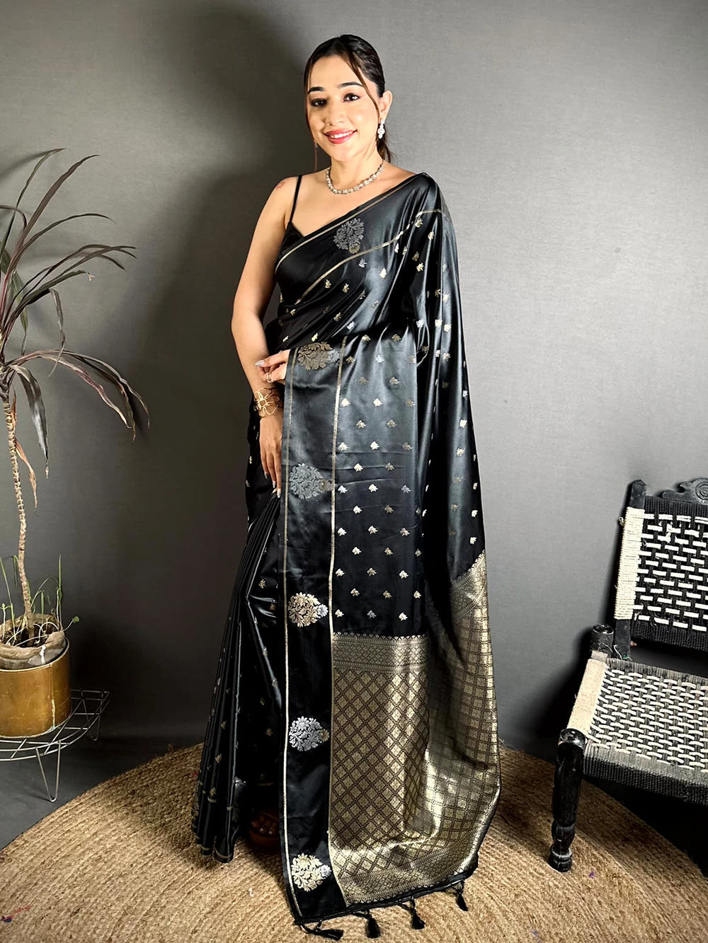 Black Mashru Silk Zari Butta Saree, full front view on a model showing the checked zari pallu and tassels at the end