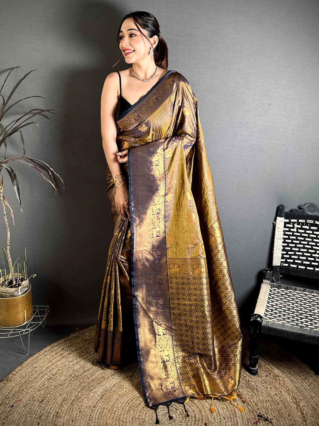 Deep bronze soft silk Kanchi-style saree, full front drape on model showing woven border and pallu