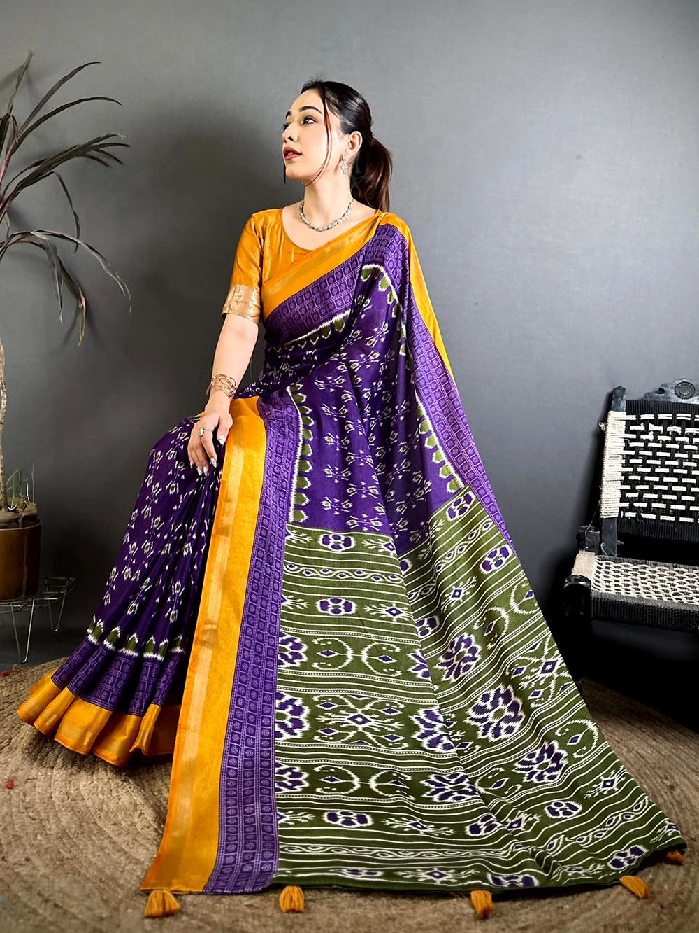 Purple Mul Cotton Ikkat Print Saree, standing view of the olive pallu with bold printed motifs and striped bands