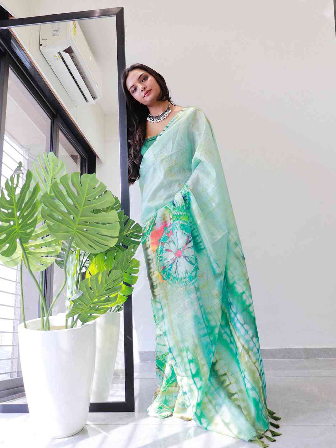 Elegant sea green tie dye satin Kota Doriya saree in natural light